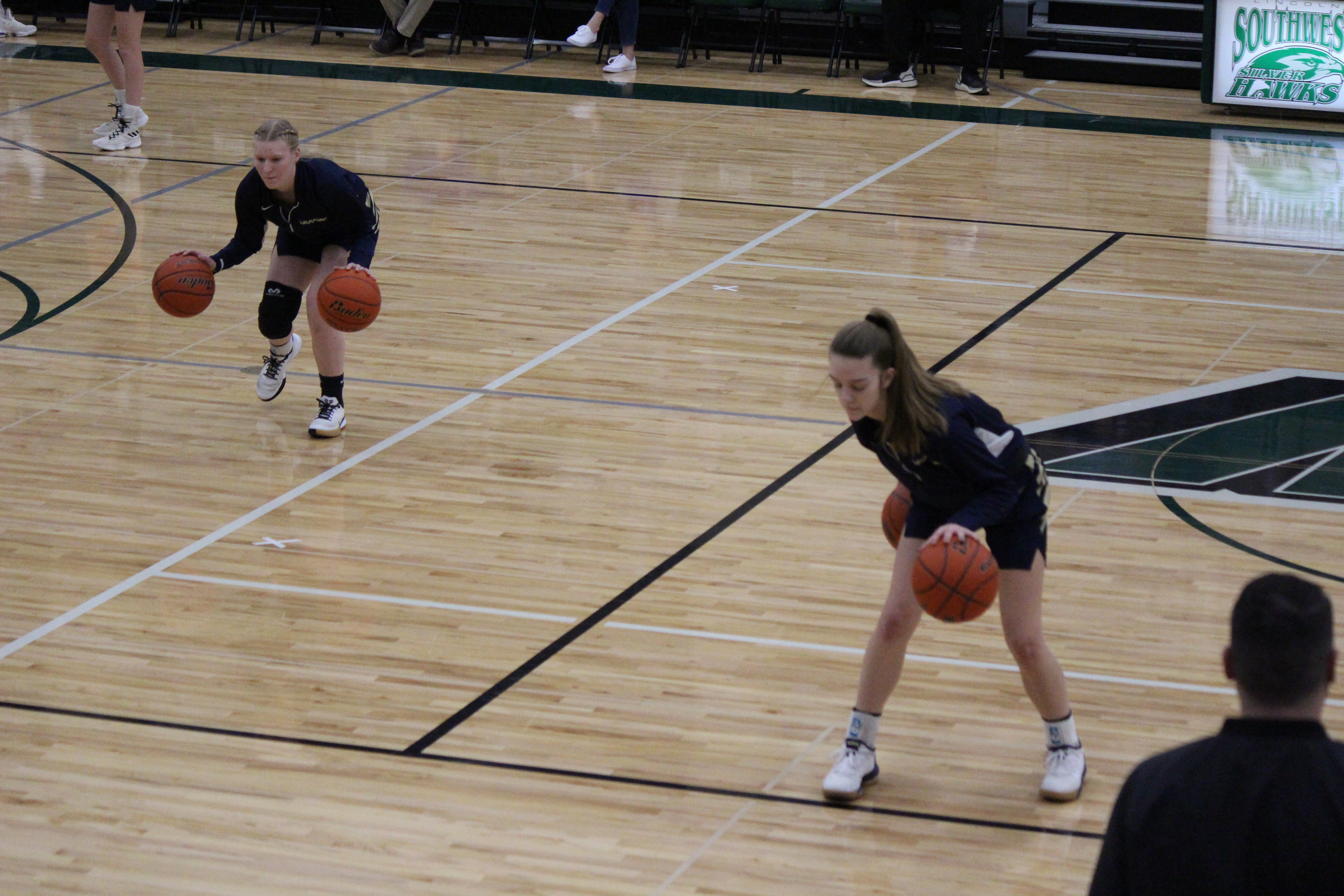 Lexie and Elayne getting warmed up before game. 